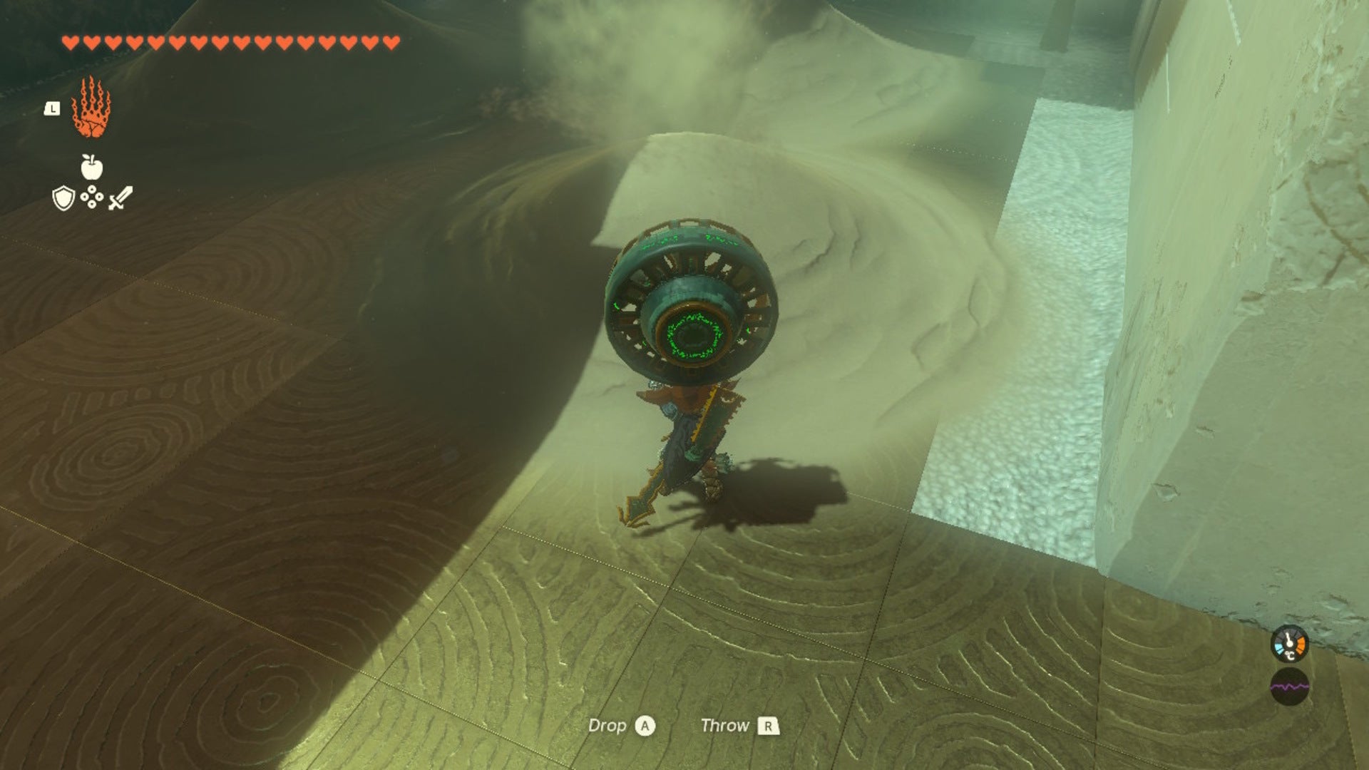 Link uses a fan on a pile of sand in The Legend of Zelda: Tears of the Kingdom - 5