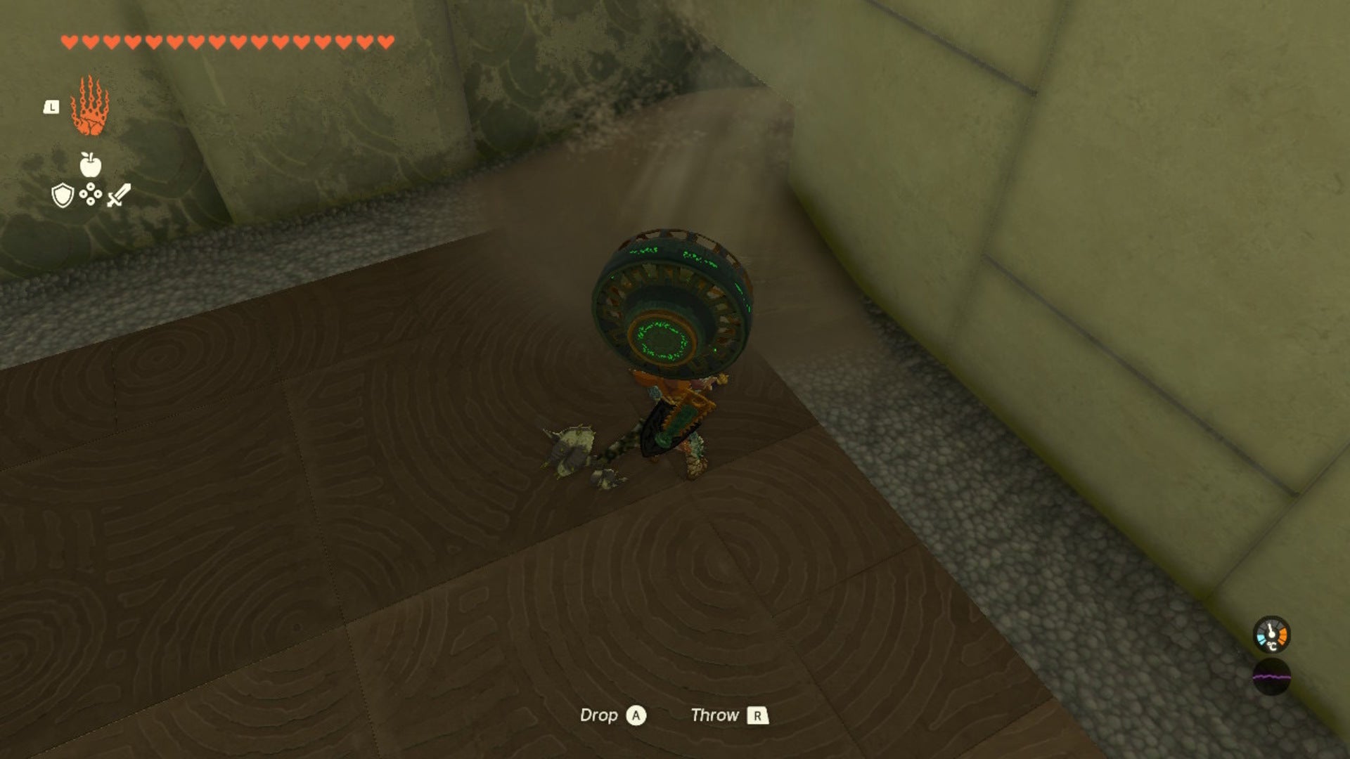 Link uses a fan on a pile of sand in The Legend of Zelda: Tears of the Kingdom