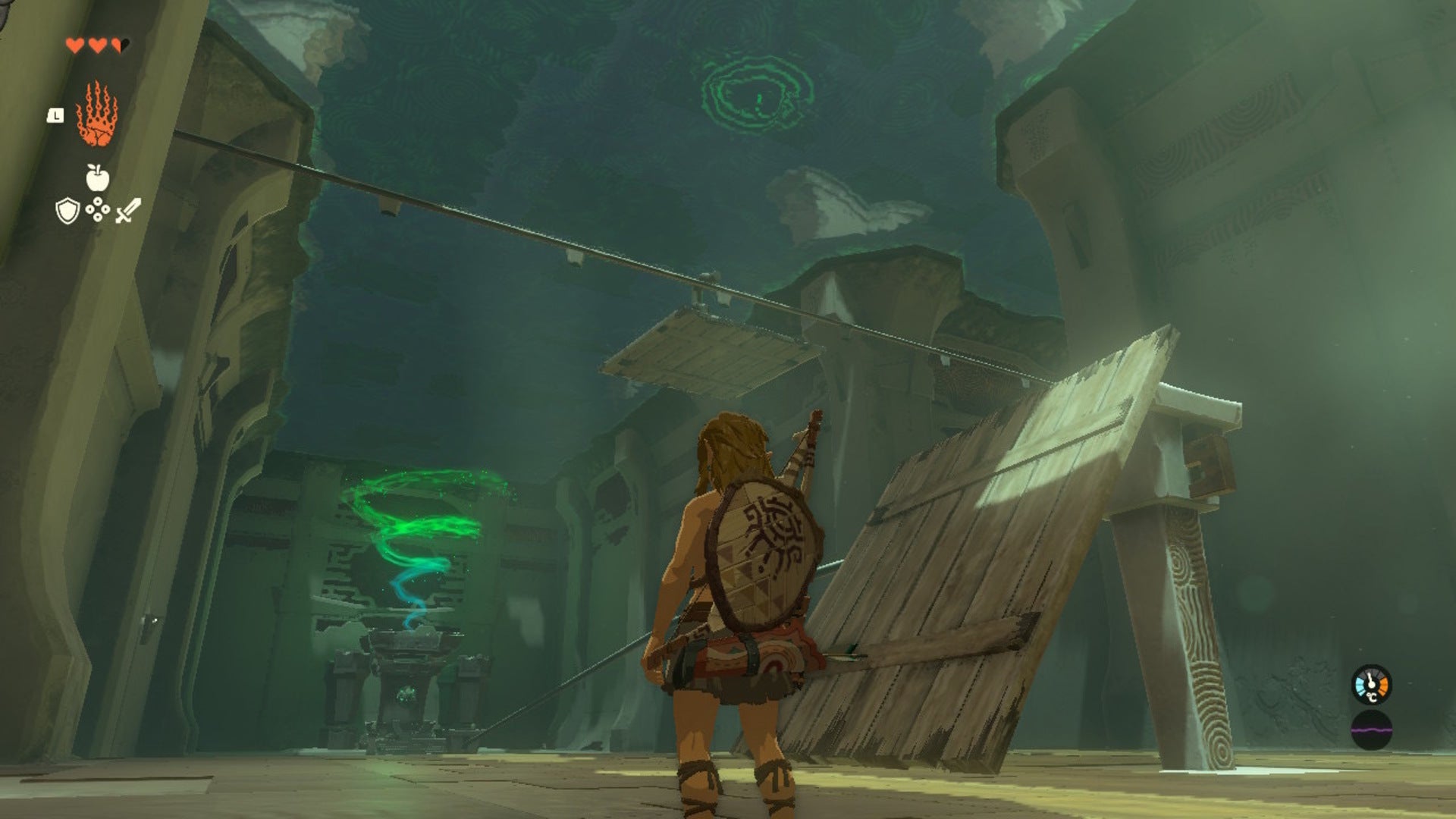 Link looks up at a platform riding along a rail in the Ukouh Shrine of The Legend of Zelda: Tears of the Kingdom - 7