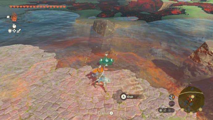 Link uses Ultrahand to pull an object from the water in The Legend of Zelda: Tears of the Kingdom
