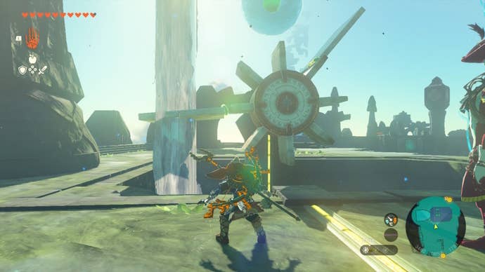 Link faces a water wheel with two planks attached in The Legend of Zelda: Tears of the Kingdom