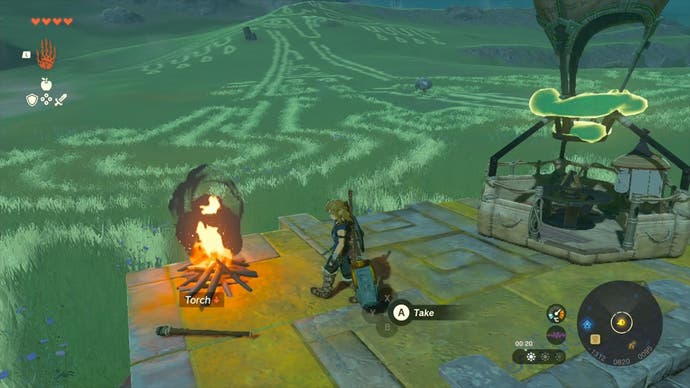 Link walking towards a campfire as he fixes Impa's hot air balloon in The Legend of Zelda: Tears of the Kingdom.