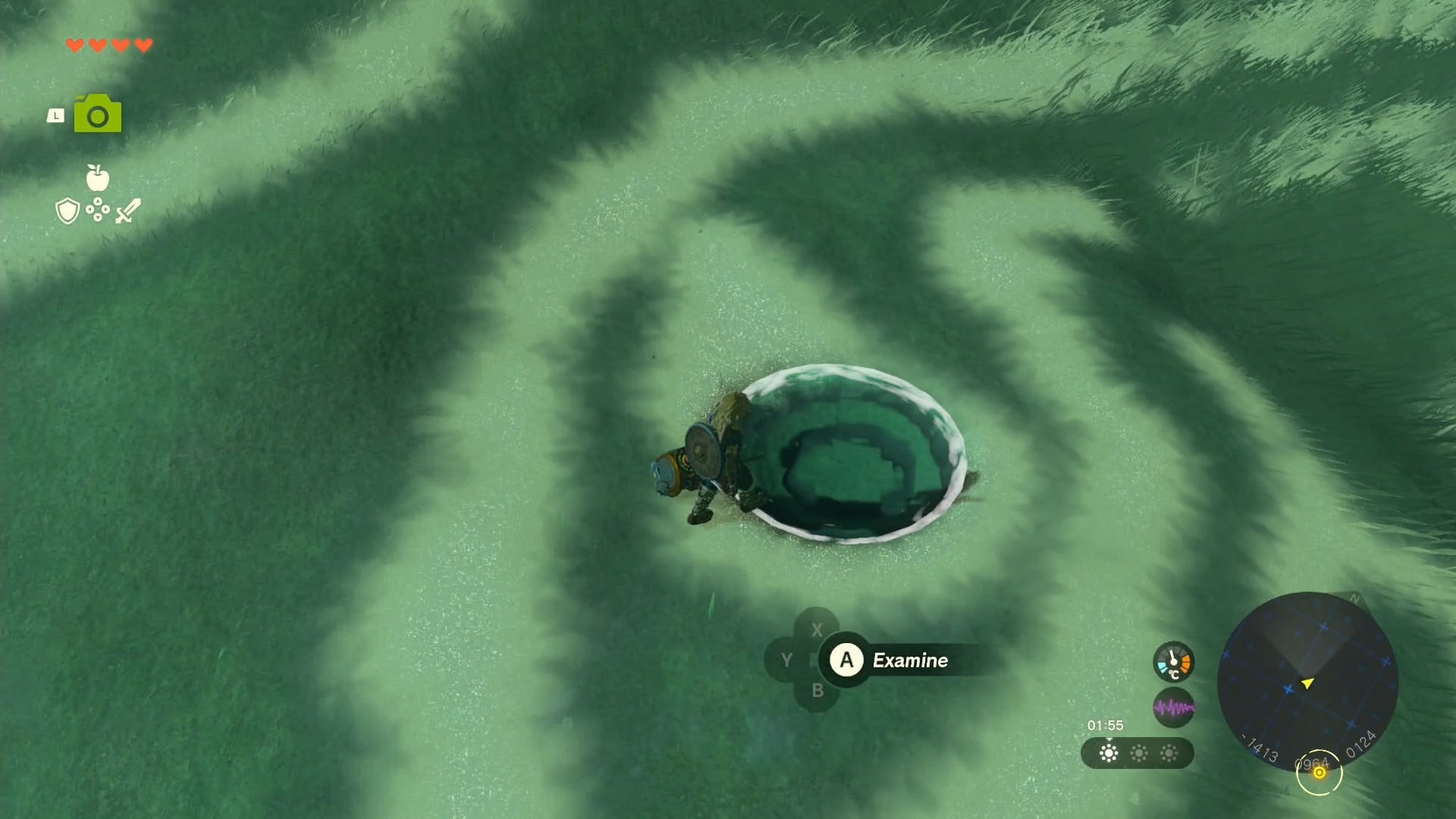 Link examining an area on the ground which lets you collect a Tear and complete the Impa and the Geoglyphs quest.
