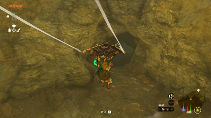 Link gliding towards the Tanagar Canyon West Cave in The Legend of Zelda: Tears of the Kingdom.
