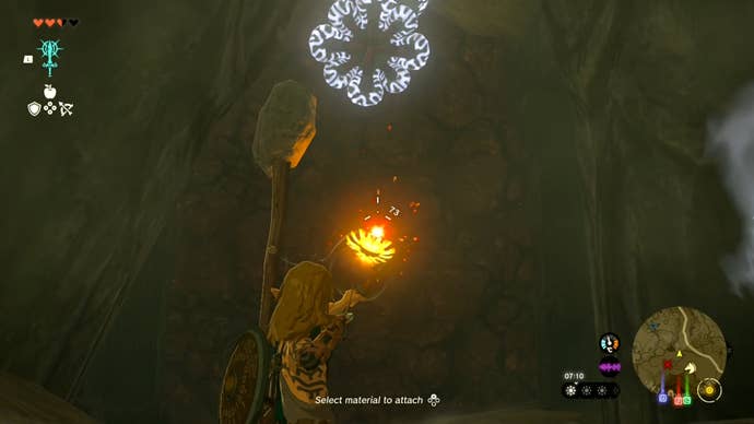 Link drawing a bomb arrow with his bow in the Tanagar Canyon West Cave in The Legend of Zelda: Tears of the Kingdom.