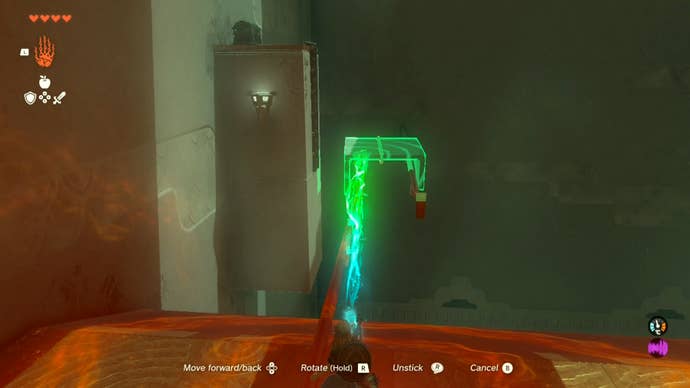 Link using the Ultrahand ability to place a stone platform on a railing in the Runakit Shrine so the player can access a treasure chest.