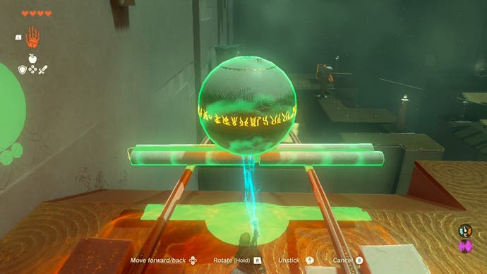 Link using a wooden contraption the player created to move a large metal ball in the Runakit Shrine.