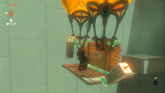 Link travelling on a hot air balloon the player created in the Sinakawak Shrine.