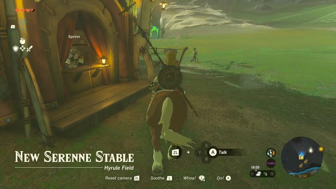 Link riding a horse around a stable in Hyrule in The Legend of Zelda: Tears of the Kingdom.