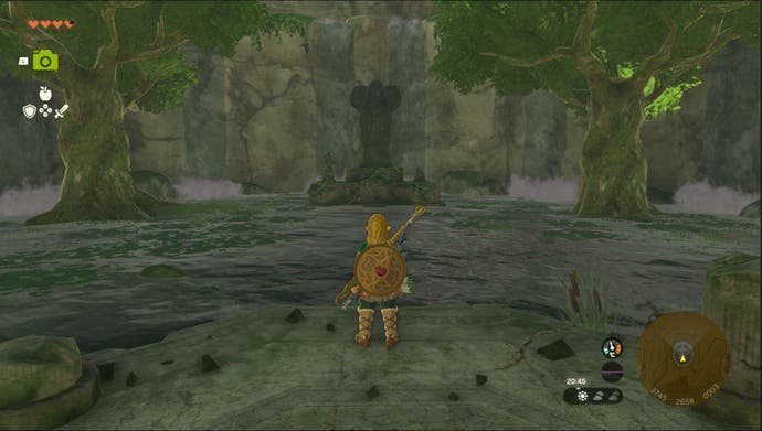 Link standing by the Spring of Power Goddess Statue in the Ulri Mountain region in Zelda: Tears of the Kingdom.