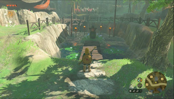 Link standing near the Kakariko Village Goddess Statue in the Sahasra Slope region in Zelda: Tears of the Kingdom.