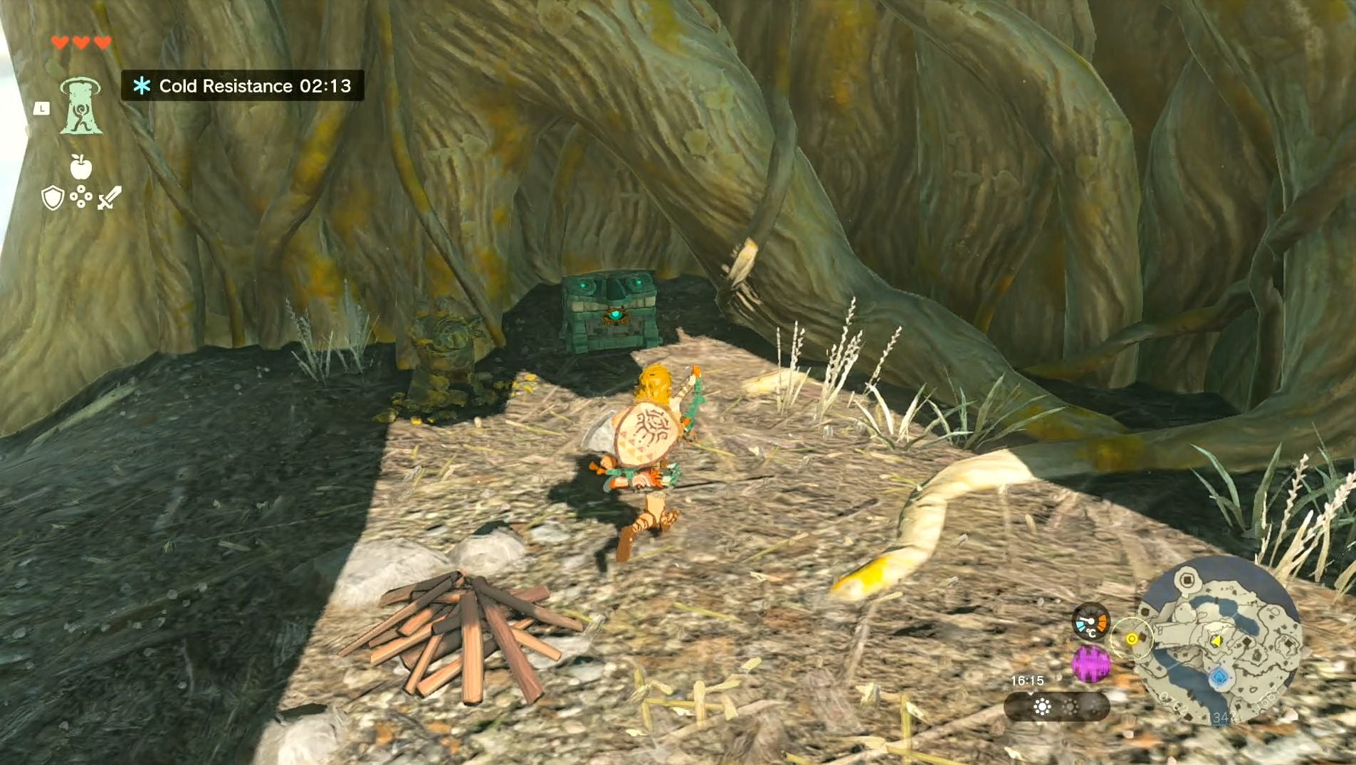 Link approaching a treasure chest that&rsquo;s hidden inside a tree in The Legend of Zelda: Tears of the Kingdom.