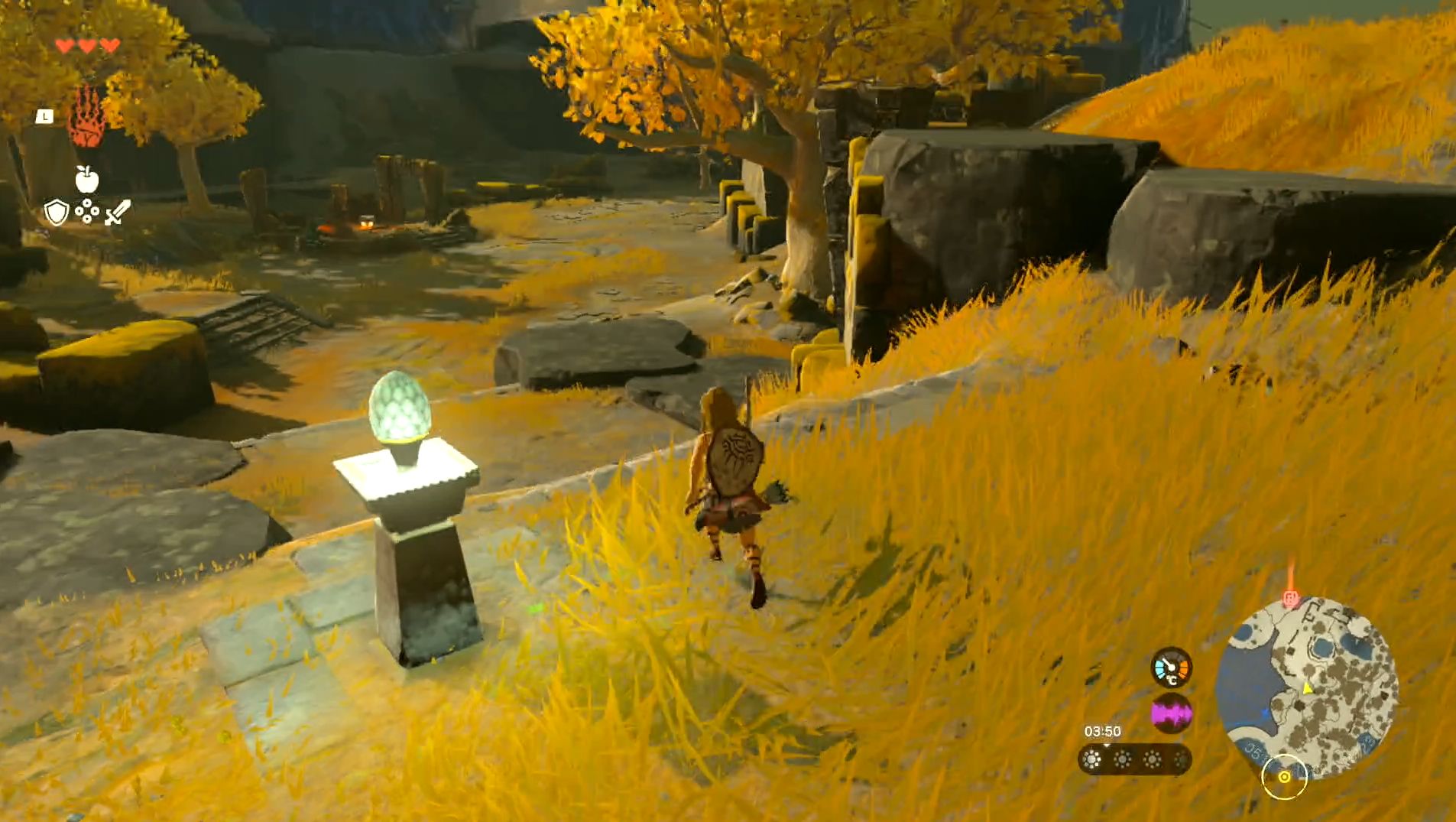 Image taken from The Legend of Zelda: Tears of the Kingdom showing Link overlooking a wooded area full of golden leaves and grass as the player heads to the Gutanbac Shrine location.