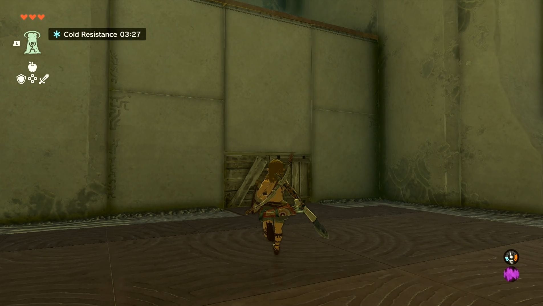 Link approaching a wall which has a small area covered with wooden planks in the Gutanbac Shrine in The Legend of Zelda: Tears of the Kingdom.