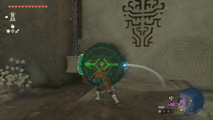 Link hitting a wheel to open a nearby door in the Left-Arm Depot in The Legend of Zelda: Tears of the Kingdom.