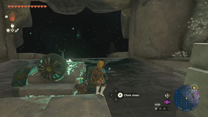 Link using a makeshift device to travel across water in the Left-Arm Depot in Tears of the Kingdom.