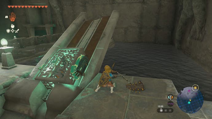 Link placing the Construct's left-leg on a stone slab that's at an angle in the Left-Leg Depot in Zelda: Tears of the Kingdom.