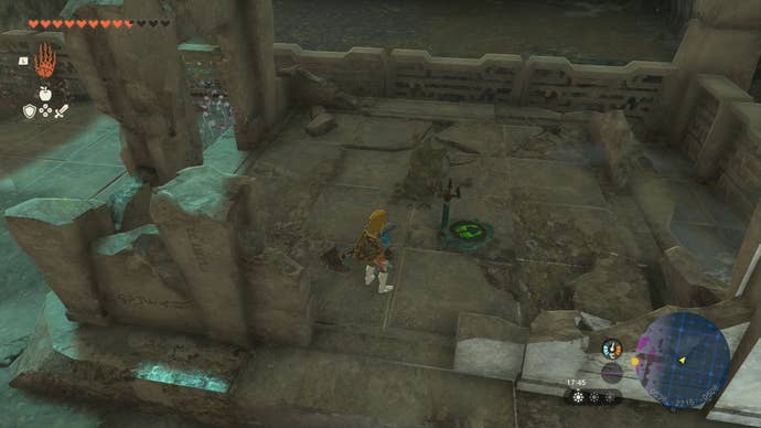 Link standing near a Steering Stick that’s located outside the Right-Arm Depot in Tears of the Kingdom.