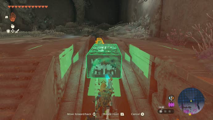 Link using his Ultrahand ability to move the Construct’s right-arm to the upper level of the Right-Arm Depot.