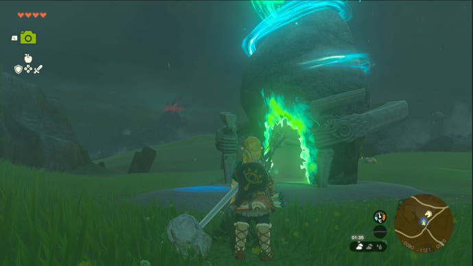 Link approaching a Shrine at night, which has a green glow surrounding it, in The Legend of Zelda: Tears of the Kingdom.