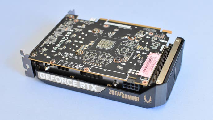 A Zotac Gaming GeForce RTX 5060 Solo sat with the circuit committee facing upwards.