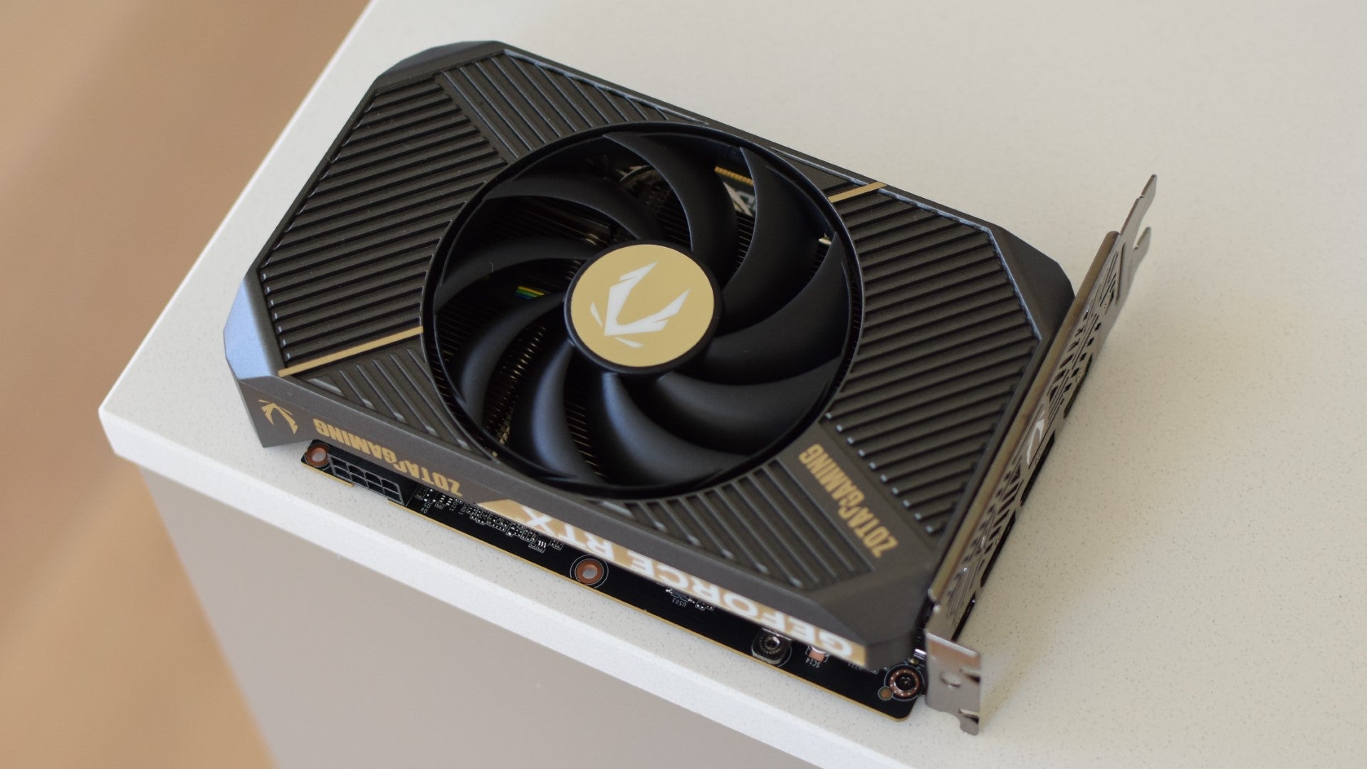 The Zotac Gaming GeForce RTX 5060 Solo graphics card on a countertop. - 1