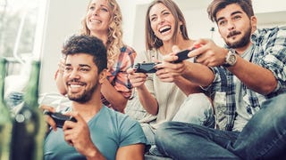 Group of adults playing a video game together