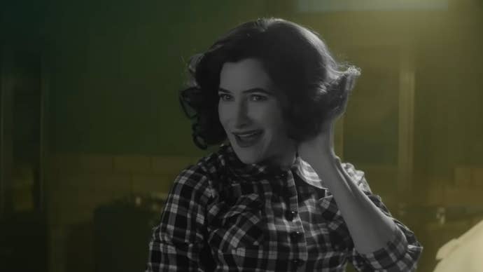 A still from Agatha All Along showing the titular character in a morgue, dressed in a 50s style look, she’s in black and white while everything else is in colour.