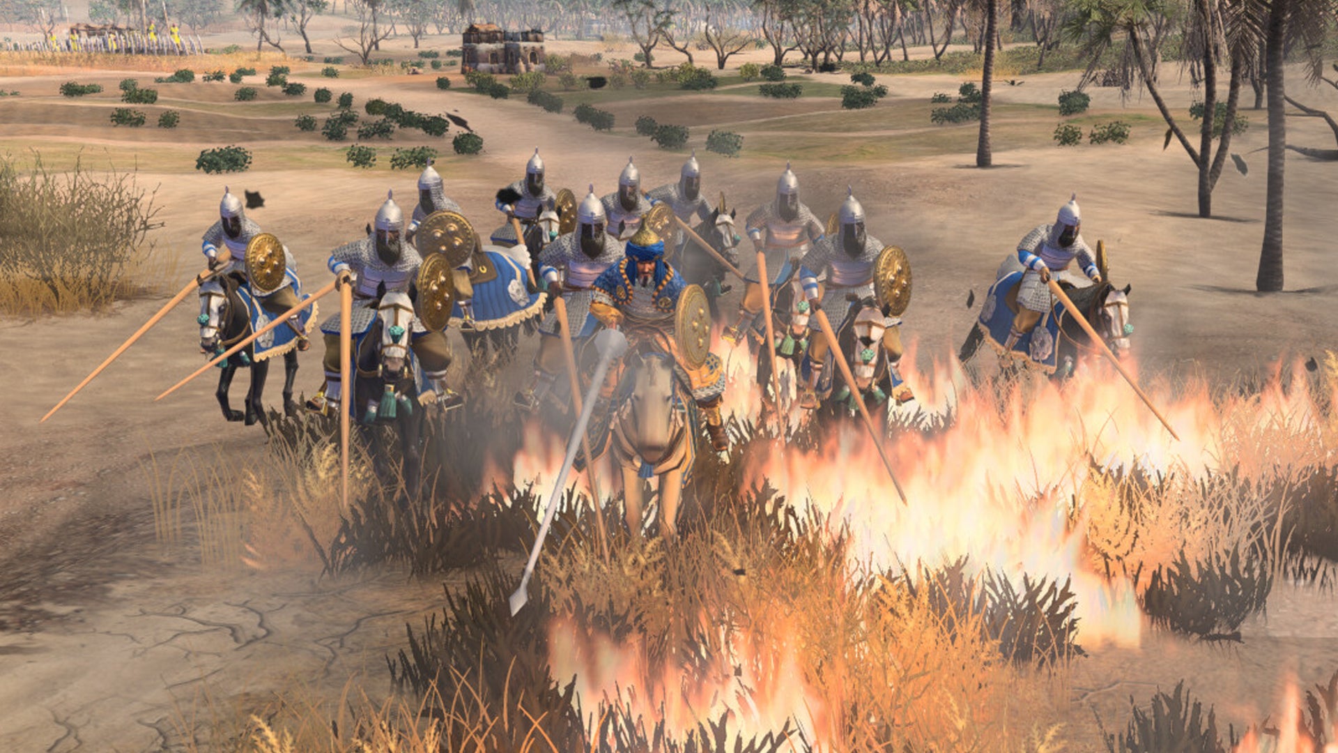 Knights charge over burning grass in Age of Empires 4 DLC The Sultans Ascend - 4
