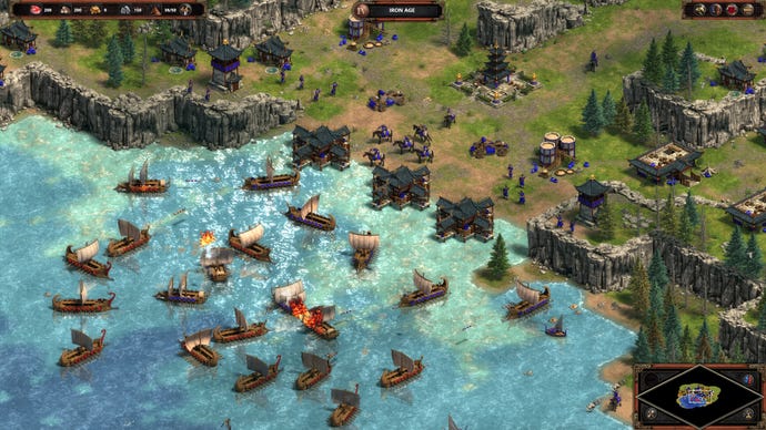 Several boats have a fight in a harbor in Age Of Empires: Definitive Edition