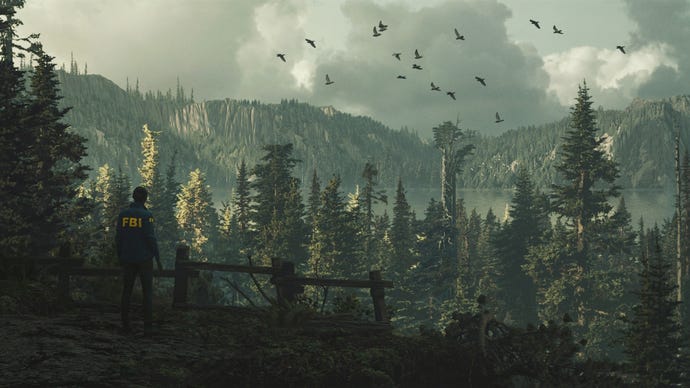 An FBI agent looks out over the heavily forested Cauldron Lake in Alan Wake 2
