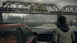 A screenshot of Alan Wake Remastered, showing Alan on a ferry approaching a town.