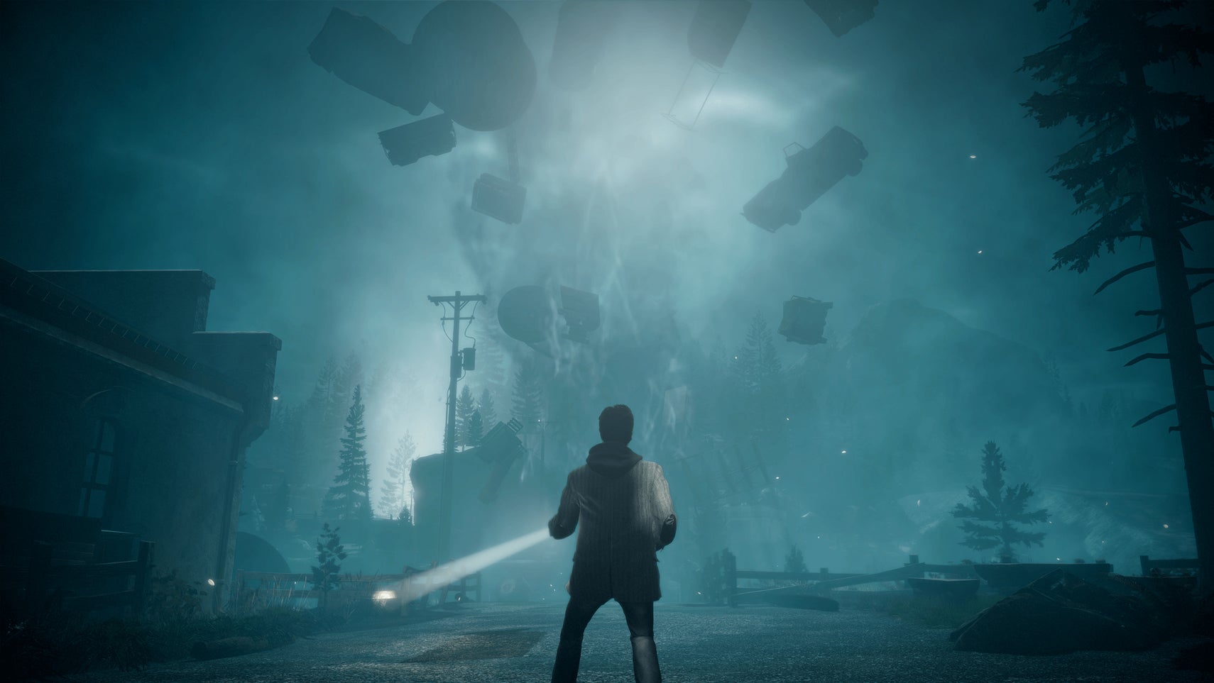 Alan Wake can be seen looking up at a supernatural tornado full of vehicles in Alan Wake Remastered - 1