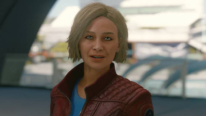 All Starfield companions: A white woman with bobbed strawberry blonde hair, wearing a red leather jacket, is standing in front of a water feature with a look of happiness on her face