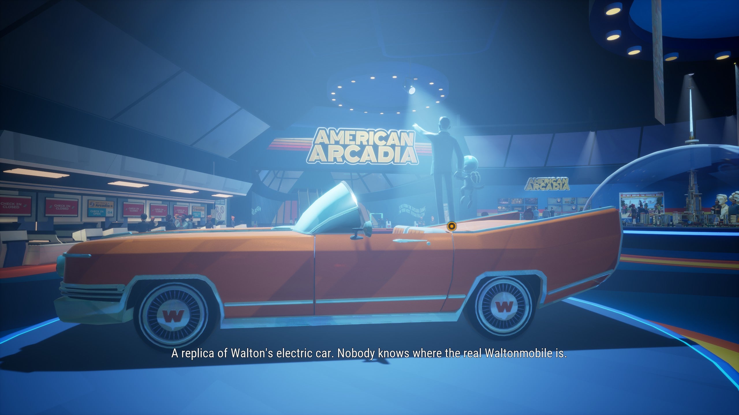 An orange convertible car on a dais. It&rsquo;s 1970s in design and gleaming.