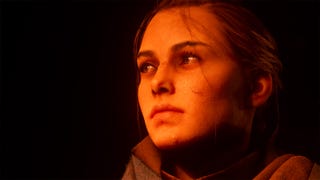 Amicia from A Plague Tale: Requiem. It's a close-up image and her face is bathed in orange light. We can see the cuts on her face. She gazes off to the left of the image with a yearning look in her eye.