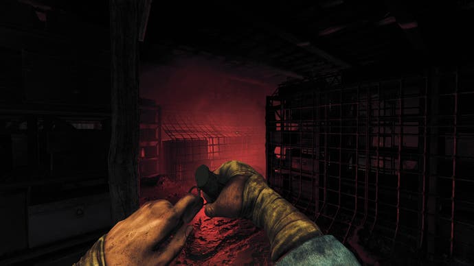 The player readying a grenade while walking through a flooded area in Amnesia: The Bunker.