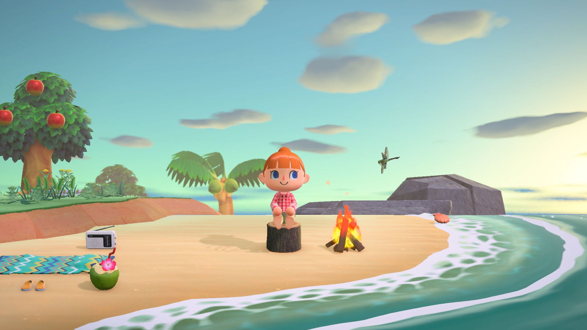 The player sits on a wooden stool beside a fire on the beach of their Animal Crossing New Horizons island - 5
