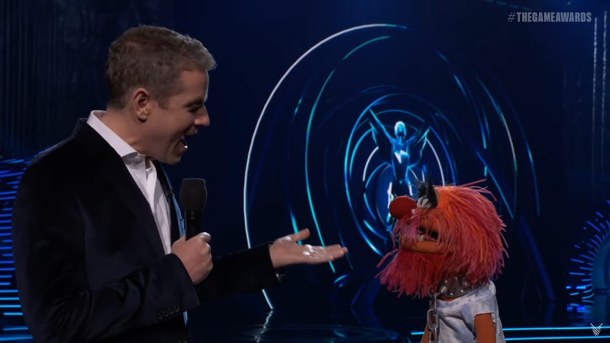 Geoff conducts an interview with a felt object.