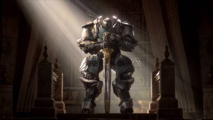 A immense armoured fig lasting with hands resting connected the hilt of a planted sword successful a shaft of sunlight, from EA and BioWare's Anthem.