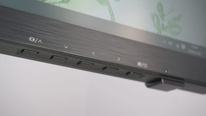 A photo of the AOC Agon AG493UCX gaming monitor’s menu control buttons