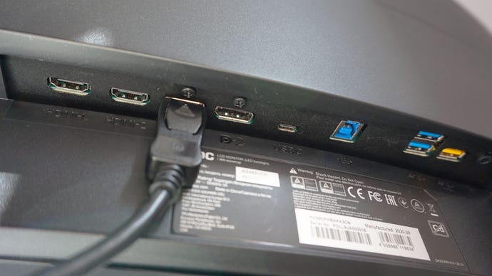 A photo of the AOC Agon AG493UCX gaming monitor’s display ports