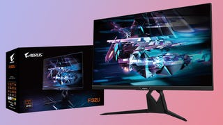 The Aorus FI32U monitor shown on a pinky-purple background with its box