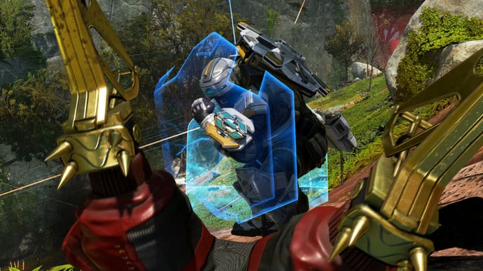 Newcastle in Apex Legends uses his wrist-mounted shield to perform a finisher on a downed enemy player.