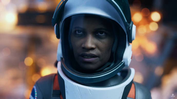The leader astronaut of Aphelion looks astatine the camera done her helmet.