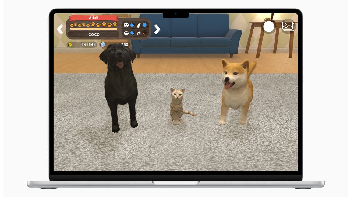 A MacBook running the Apple Arcade game with My Buddy, where players bond with cute cats and dogs.
