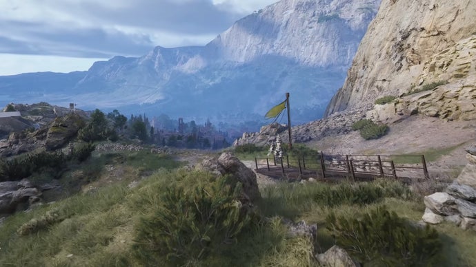 An establishing shot of the Blue Gate map in Arc Raiders, with grassy hills in the foreground and a large mountain range in the distance.