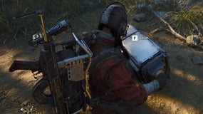 A close-up of a player character in Arc Raiders, with a backpack full of gear, carrying an ARC Field Crate with both hands outdoors.