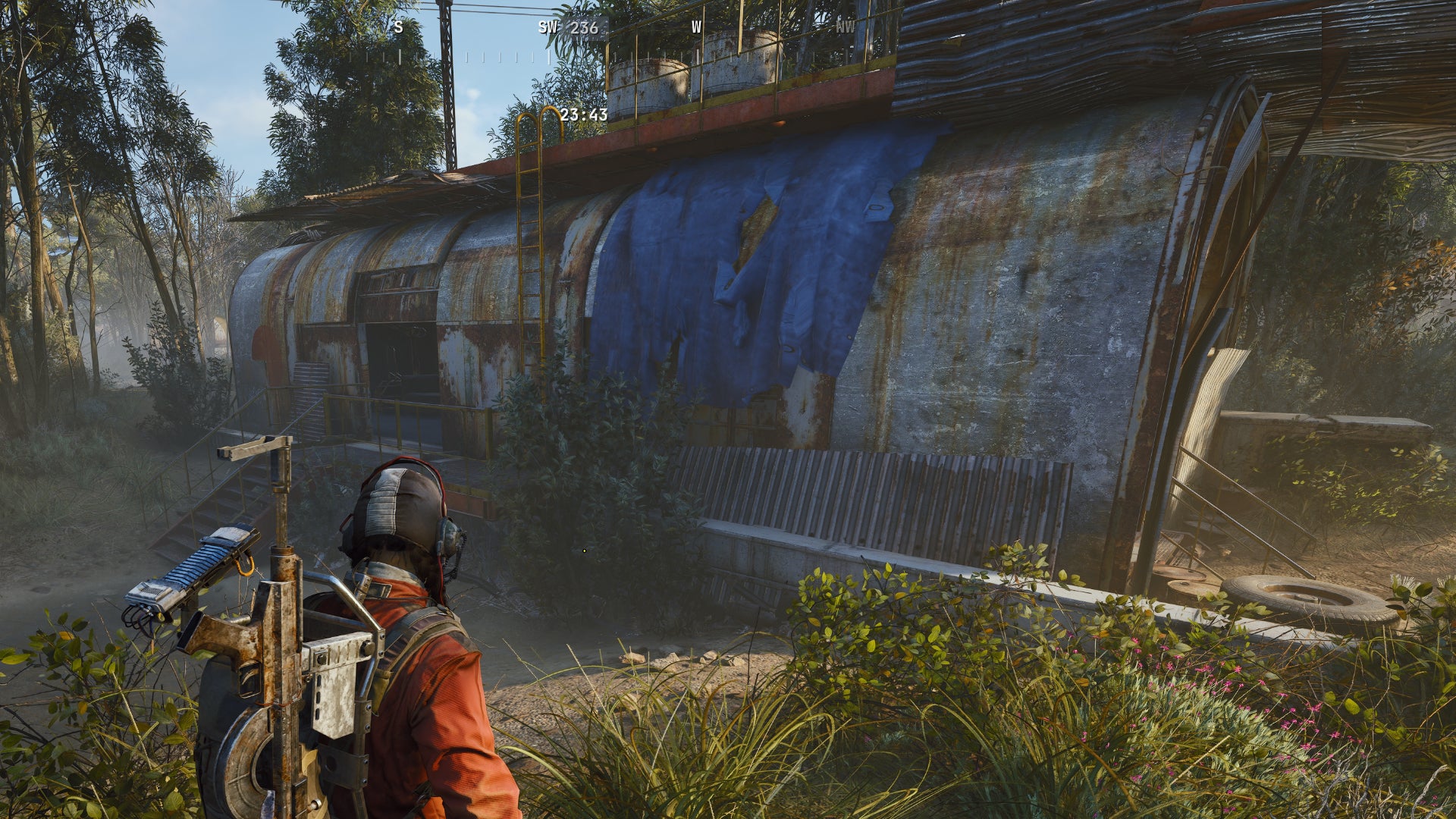 A close-up of the long side of a Field Depot in Arc Raiders, surrounded by grassy forest. - 1