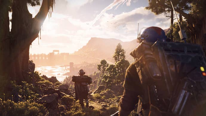 Two people in post-apocalyptic gear are walking through the woods looking out over a hill in Arc Raiders.